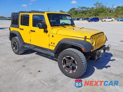 Czwarte zdjęcie samochodu z boku: 2009 JEEP WRANGLER UNLIMITED X VIN:1J4GA39169L700197 - miniatura