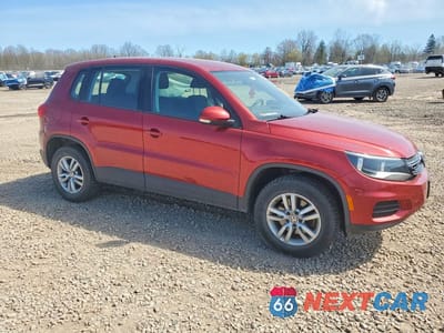 Czwarte zdjęcie samochodu z boku: 2014 VOLKSWAGEN TIGUAN S VIN:WVGBV3AX5EW012944 - miniatura