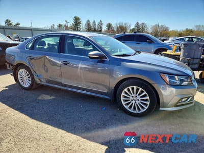 Czwarte zdjęcie samochodu z boku: 2016 VOLKSWAGEN PASSAT SE VIN:1VWBT7A37GC069856 - miniatura