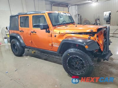 Czwarte zdjęcie samochodu z boku: 2011 JEEP WRANGLER UNLIMITED RUBICON VIN:1J4BA6H1XBL520174 - miniatura