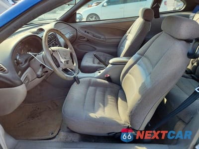 Zdjęcie 7 z 11 samochodu: 1997 FORD MUSTANG VIN:1FALP404XVF207704 - miniatura