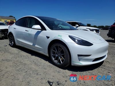 Czwarte zdjęcie samochodu z boku: 2021 TESLA MODEL 3 VIN:5YJ3E1EA8MF877879 - miniatura