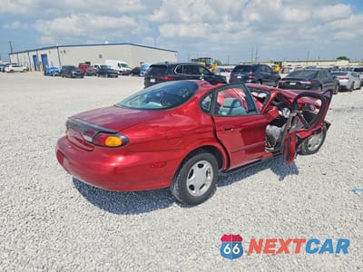 Trzecie zdjęcie samochodu z tyłu: 1997 FORD TAURUS GL VIN:1FALP52U7VA129396 - miniatura