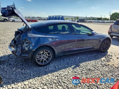 Trzecie zdjęcie samochodu z tyłu: 2020 TESLA MODEL 3 VIN:5YJ3E1EA3LF590304 - miniatura