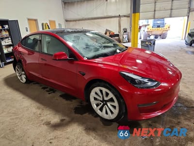 Czwarte zdjęcie samochodu z boku: 2022 TESLA MODEL 3 VIN:5YJ3E1EA5NF369824 - miniatura