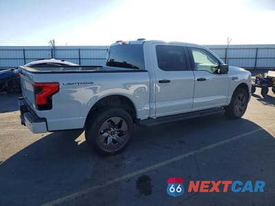 Trzecie zdjęcie samochodu z tyłu: 2024 FORD F150 LIGHTNING XLT VIN:1FTVW3LK1RWG31174 - miniatura