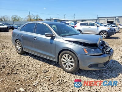 Czwarte zdjęcie samochodu z boku: 2014 VOLKSWAGEN JETTA SE VIN:3VWD07AJ9EM381737 - miniatura