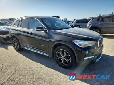 Czwarte zdjęcie samochodu z boku: 2017 BMW X1 SDRIVE28I VIN:WBXHU7C30H5H38374 - miniatura