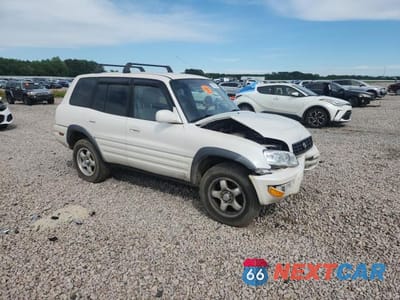 Czwarte zdjęcie samochodu z boku: 1999 TOYOTA RAV4 BASE VIN:JT3HP10V7X7117595 - miniatura