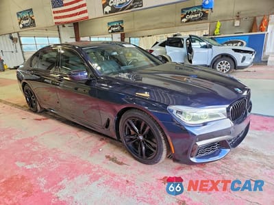 Czwarte zdjęcie samochodu z boku: 2017 BMW 750 XI VIN:WBA7F2C58HG422064 - miniatura