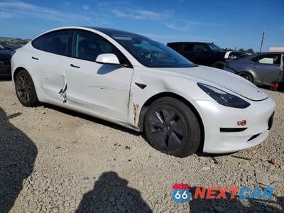 Czwarte zdjęcie samochodu z boku: 2023 TESLA MODEL 3 VIN:5YJ3E1EA7PF465358 - miniatura