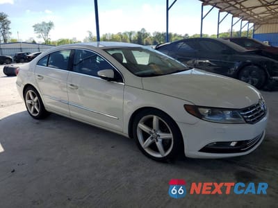 Czwarte zdjęcie samochodu z boku: 2014 VOLKSWAGEN CC SPORT VIN:WVWBP7AN4EE530313 - miniatura