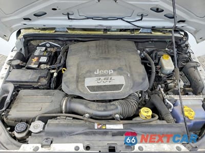 Zdjęcie 12 z 13 samochodu: 2013 JEEP WRANGLER UNLIMITED SPORT VIN:1C4HJWDG4DL553961 - miniatura