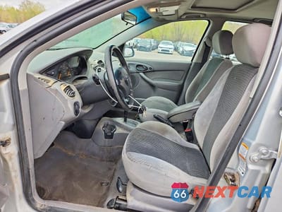 Zdjęcie 7 z 12 samochodu: 2002 FORD FOCUS ZX5 VIN:3FAHP373X2R192018 - miniatura