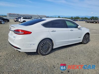 Trzecie zdjęcie samochodu z tyłu: 2017 FORD FUSION TITANIUM HEV VIN:3FA6P0RU1HR129698 - miniatura