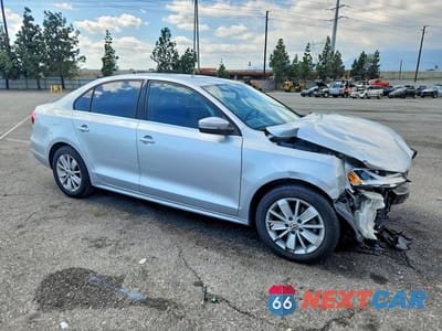 Czwarte zdjęcie samochodu z boku: 2015 VOLKSWAGEN JETTA TDI VIN:3VWLA7AJ3FM293549 - miniatura