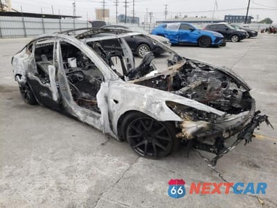 Czwarte zdjęcie samochodu z boku: 2022 TESLA MODEL 3 VIN:5YJ3E1EA0NF360982 - miniatura