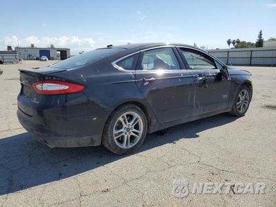 Trzecie zdjęcie samochodu z tyłu: 2016 FORD FUSION TITANIUM PHEV VIN:3FA6P0SU3GR397340 - miniatura