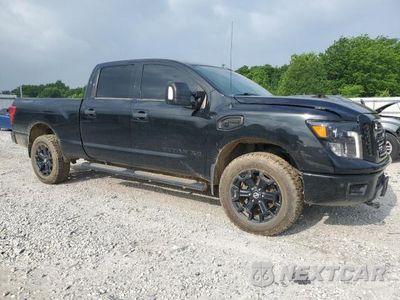 Czwarte zdjęcie samochodu z boku: 2019 NISSAN TITAN XD SL VIN:1N6BA1F4XKN534423 - miniatura