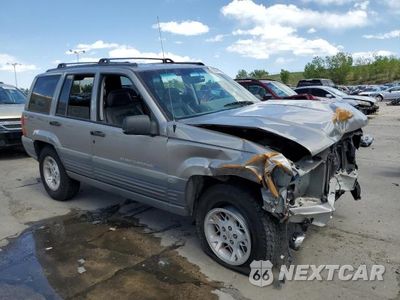 Czwarte zdjęcie samochodu z boku: 1998 JEEP GRAND CHEROKEE LAREDO VIN:1J4GZ58Y1WC125392 - miniatura