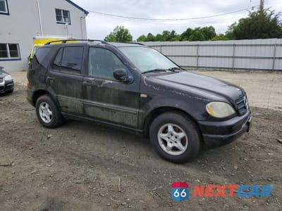 Czwarte zdjęcie samochodu z boku: 2001 MERCEDES-BENZ ML 320 VIN:4JGAB54E71A233494 - miniatura