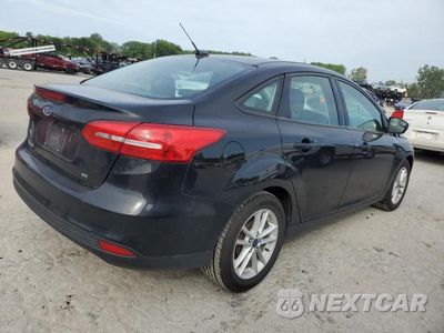 Trzecie zdjęcie samochodu z tyłu: 2017 FORD FOCUS SE VIN:1FADP3F20HL231486 - miniatura