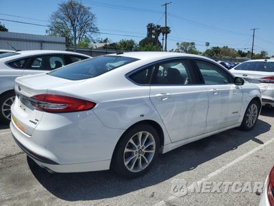 Trzecie zdjęcie samochodu z tyłu: 2017 FORD FUSION SE HYBRID VIN:3FA6P0LU0HR409329 - miniatura