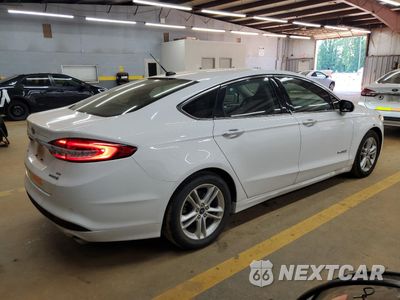 Trzecie zdjęcie samochodu z tyłu: 2018 FORD FUSION SE HYBRID VIN:3FA6P0LU7JR171999 - miniatura