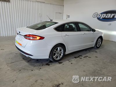Trzecie zdjęcie samochodu z tyłu: 2018 FORD FUSION SE HYBRID VIN:3FA6P0LU5JR171838 - miniatura