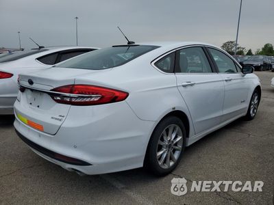 Trzecie zdjęcie samochodu z tyłu: 2017 FORD FUSION SE HYBRID VIN:3FA6P0LUXHR409144 - miniatura