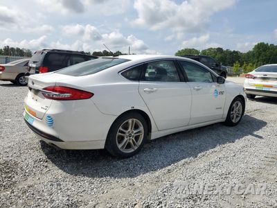 Trzecie zdjęcie samochodu z tyłu: 2018 FORD FUSION SE HYBRID VIN:3FA6P0LU1JR171755 - miniatura