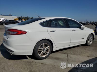 Trzecie zdjęcie samochodu z tyłu: 2018 FORD FUSION SE HYBRID VIN:3FA6P0LU3JR278645 - miniatura