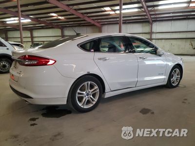 Trzecie zdjęcie samochodu z tyłu: 2018 FORD FUSION SE HYBRID VIN:3FA6P0LUXJR171799 - miniatura