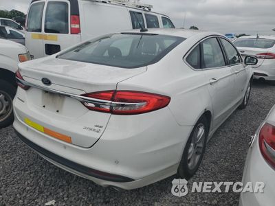 Trzecie zdjęcie samochodu z tyłu: 2018 FORD FUSION SE HYBRID VIN:3FA6P0LU8JR129924 - miniatura