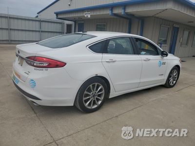 Trzecie zdjęcie samochodu z tyłu: 2017 FORD FUSION SE HYBRID VIN:3FA6P0LUXHR409239 - miniatura