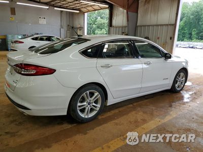 Trzecie zdjęcie samochodu z tyłu: 2018 FORD FUSION SE HYBRID VIN:3FA6P0LU2JR178455 - miniatura