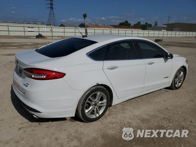Trzecie zdjęcie samochodu z tyłu: 2018 FORD FUSION SE HYBRID VIN:3FA6P0LU9JR171597 - miniatura