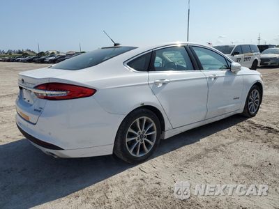 Trzecie zdjęcie samochodu z tyłu: 2017 FORD FUSION SE HYBRID VIN:3FA6P0LU4HR410046 - miniatura