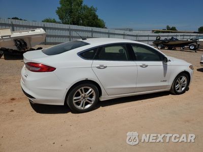Trzecie zdjęcie samochodu z tyłu: 2018 FORD FUSION SE HYBRID VIN:3FA6P0LU0JR171844 - miniatura
