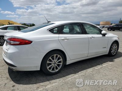 Trzecie zdjęcie samochodu z tyłu: 2017 FORD FUSION SE HYBRID VIN:3FA6P0LUXHR409158 - miniatura