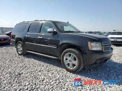 Czwarte zdjęcie samochodu z boku: 2010 CHEVROLET SUBURBAN K1500 LTZ VIN:1GNUKKE38AR179628 - miniatura