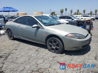 Czwarte zdjęcie samochodu z boku: 1999 MERCURY COUGAR V6 VIN:1ZWFT61L7X5652018 - miniatura