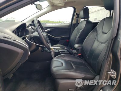 Zdjęcie 7 z 12 samochodu: 2016 FORD FOCUS TITANIUM VIN:1FADP3J29GL384695 - miniatura