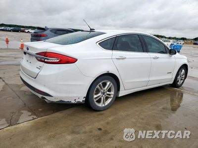 Trzecie zdjęcie samochodu z tyłu: 2018 FORD FUSION SE HYBRID VIN:3FA6P0LU9JR129799 - miniatura