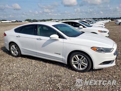 Czwarte zdjęcie samochodu z boku: 2018 FORD FUSION SE HYBRID VIN:3FA6P0LU1JR171691 - miniatura