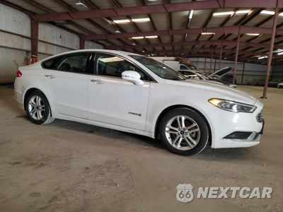 Czwarte zdjęcie samochodu z boku: 2018 FORD FUSION SE HYBRID VIN:3FA6P0LU6JR163490 - miniatura