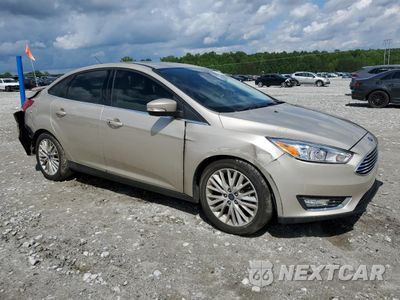 Czwarte zdjęcie samochodu z boku: 2017 FORD FOCUS TITANIUM VIN:1FADP3J28HL256188 - miniatura