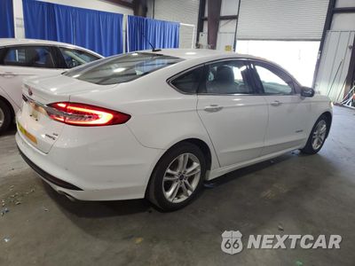 Trzecie zdjęcie samochodu z tyłu: 2018 FORD FUSION SE HYBRID VIN:3FA6P0LU0JR118836 - miniatura