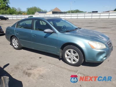 Czwarte zdjęcie samochodu z boku: 2002 NISSAN ALTIMA BASE VIN:1N4AL11D62C114854 - miniatura