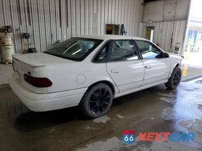 Trzecie zdjęcie samochodu z tyłu: 1995 FORD TAURUS GL VIN:1FALP52U4SA166031 - miniatura